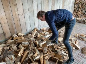 A1Exterminators 5 Ways To Detect a Termite Swarm In Your House 2 Man in the middle of a pile of wood. Termite swarm detection